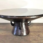 Round Coffee Table with Unique Wood Base from Gado Gado Round Coffee Table with Unique Wood Base
