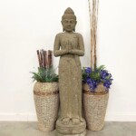 Tall Carved Stone Standing Buddha Statue at Gado Gado