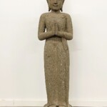 Tall Carved Stone Standing Buddha Statue at Gado Gado